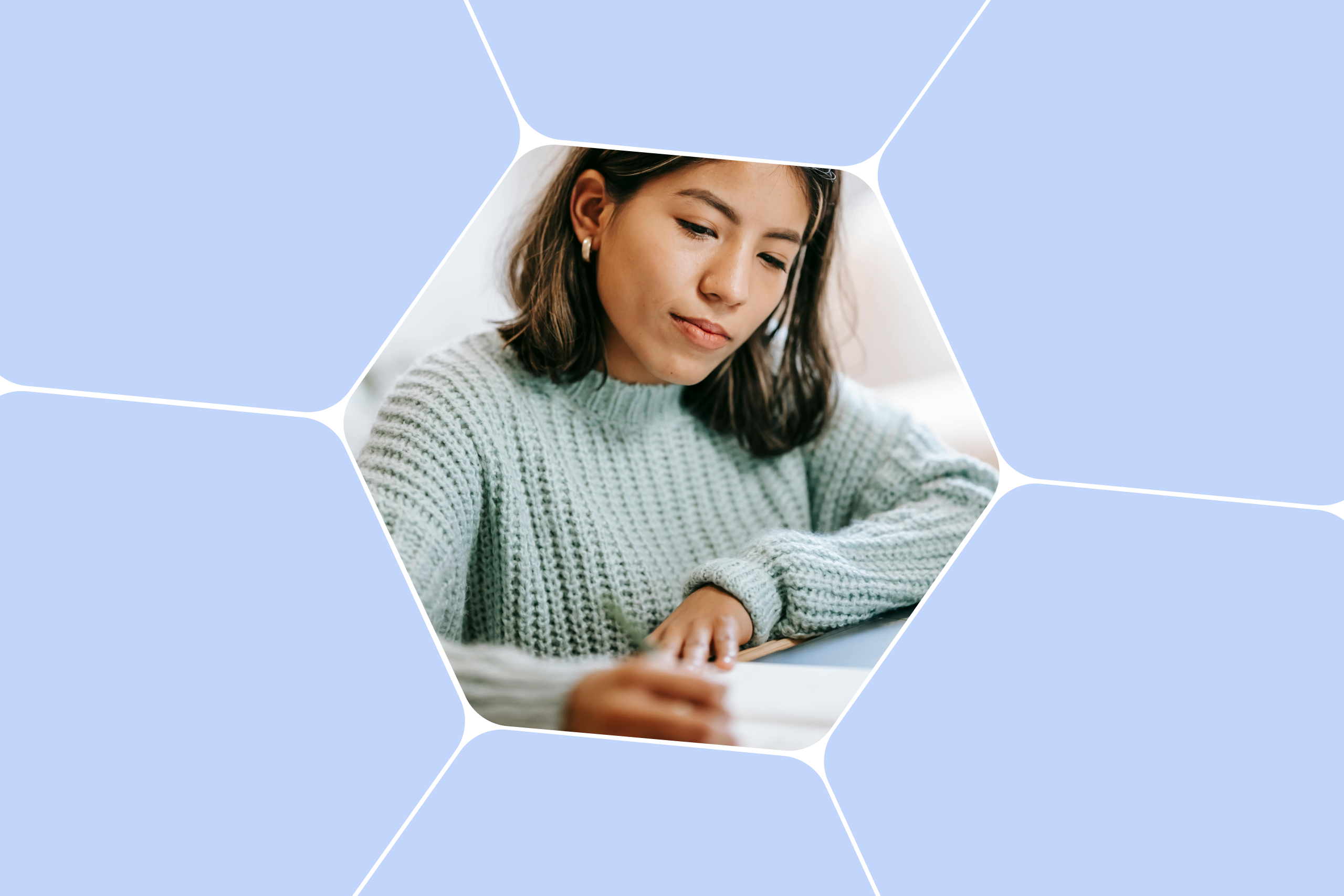 A young lady in hyper focus drafts a resume